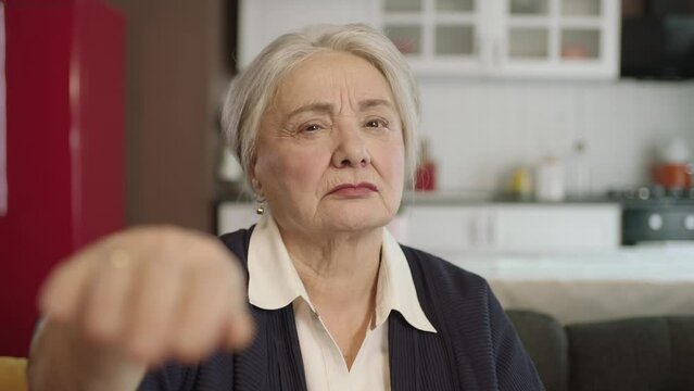 Portrait of human hand showing to camera.The old woman extending her hand to kiss her visitors during the feast (Ramadan or Şeker Bayram). People who adhere to Muslim traditions.