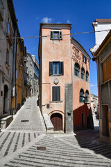 A narrow street between the old houses of Morcone, a village in the province of Benevento, Italy.