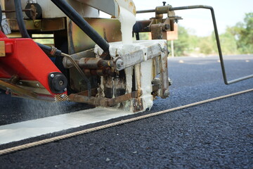 Blurred image, working on traffic lines for travel safety