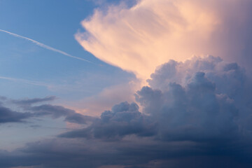 Picture dramatic clouds just before sunset. Landscape size.