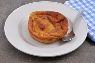 Far breton in a plate with a spoon | Far breton dans une assiette avec une cuillère