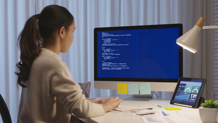 Asia people MBA college woman work busy at late night home office online study on laptop typing...