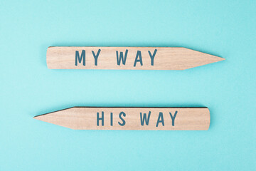 The words my way his way are standing on wooden arrows, christian religion faith, trust and believe...