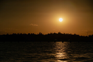 Naklejka premium sunset over the river