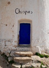 Close up of blue entrance door of Chispas windmill in Consuegra, Castile La Mancha, Spain.