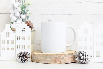 Mockup of a white ceramic mug with winter symbols