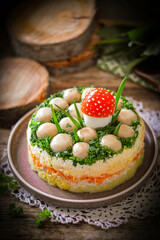 Layered salad with whole champignon mushrooms 
