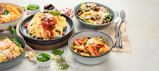 Italian pasta assortment on light background.