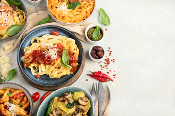 Italian pasta assortment on light background.