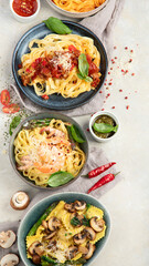 Italian pasta assortment on light background.