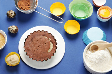 Freshly baked cake on blue background.