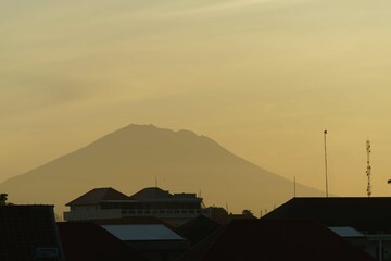 Fototapeta na wymiar yellow sunset with mountain