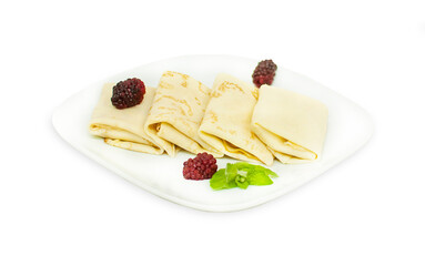 Crepes with cottage cheese, raspberry and mint. Thin pancakes with fillings. Pancakes flapjack thin cake curd filling crepe cottage cheese. on white plate.