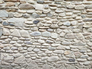 Natural boulder pebble stones wall background
