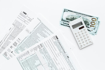 Annual tax form under US law with money cash. Tax payment season