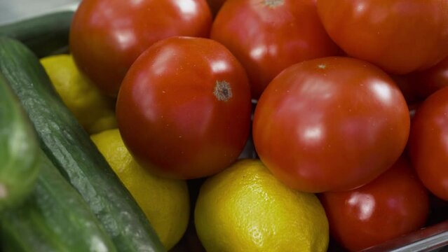 Fresh farm vegetables, tomatoes, cucumbers, lemons, macro photography. Preparing food. Healthy eating.