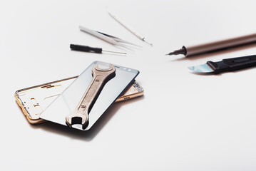 Flat lay image of dismantling the broken smart phone for preparing to repair or replace some...