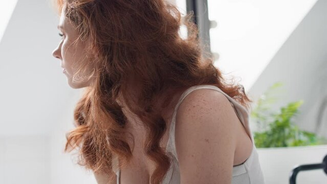 Caucasian woman with problems sitting in the bathroom. Shot with RED helium camera in 8K. 
