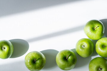 top view of delicious and ripe apples on white.