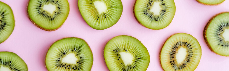 top view of sliced fresh kiwi on pink, banner. - obrazy, fototapety, plakaty