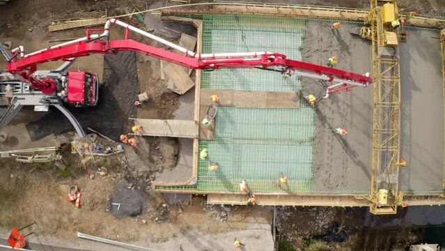 Aerial Top Forward Shot Of Male Workers Working At Construction Site On Road - Van Buren, Arkansas