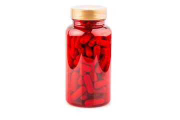 Prescription drugs flowing from red capsule bottle isolated on white