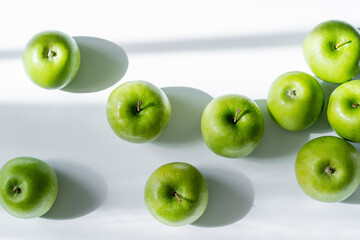 top view of tasty and ripe apples on white.