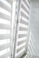 Window roller duo system day and night. Close up on roll curtains indoor.