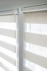 Window roller duo system day and night. Close up on roll curtains indoor.
