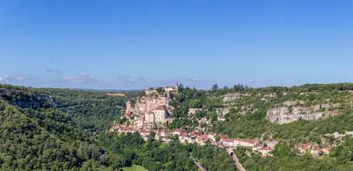 Geology and geography of surroundings of Rocamadour holy village, gorge of Alzou river on clear sunny morning. Lot, Occitania, Southwestern France