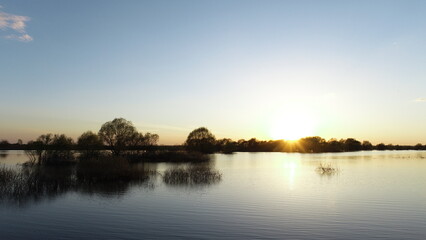 Sunset over a flooded river
