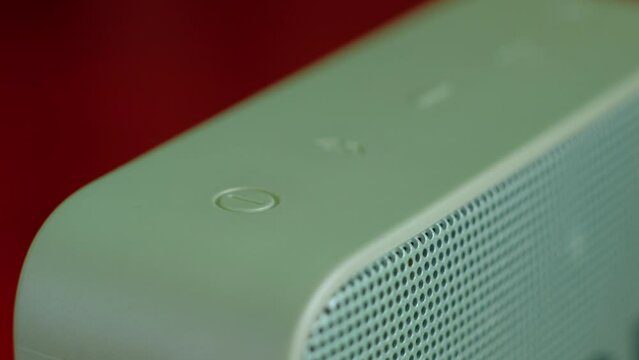 Finger pressing power and connection push button on bluetooth portable speaker 