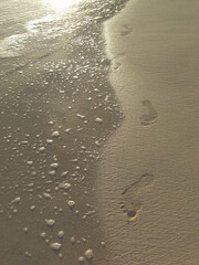 Beach activity, letters and footsteps on the sand, Hawaiian island, year 2011, Kailua beach on Oahu island