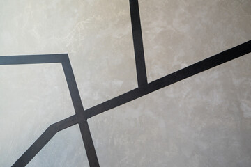 Paint black color to line boundary on the raw concrete background. Vintage wall.