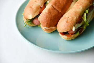 Hot dogs with sausage on a plate