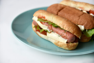 Hot dogs with sausage on a plate
