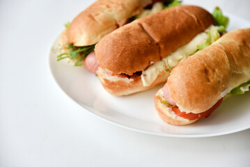 Hot dogs with sausage on a plate