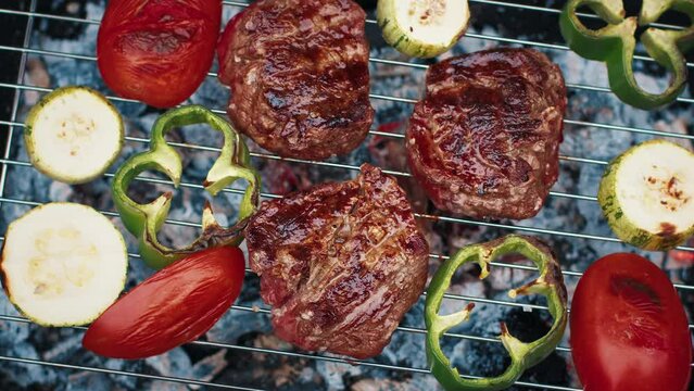 BBQ in the garden. Filet mignon and vegetables on the charcoal grill