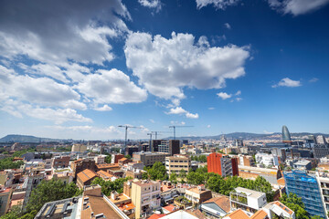 Naklejka na ściany i meble Barcelona skyline with passing clouds