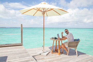 blogger at work in Maldives in a sunny day