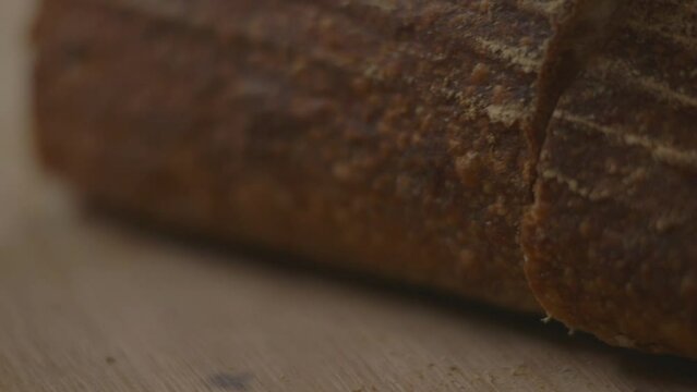 Close up of bread being cut