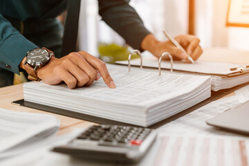 Business hands pointing for checking documents. Businessman analyzing financial report company and...