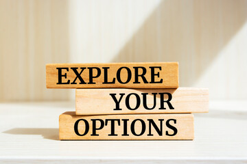 Wooden blocks with words 'Explore your options'.