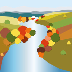 Landscape with fields and a river, on the banks of the trees in autumn