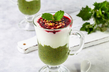 Delicious dessert with a layer of yogurt, nettle smoothie and honeysuckle jam. Dessert is served in...
