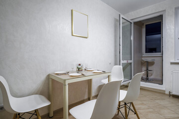 served table in the living room or kitchen with cups, plates, glasses and flowers