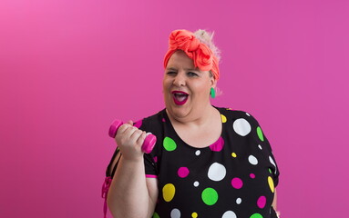 Fat woman dieting, fitness and healthy food at home.Big woman and sport. Health, fitness and sports concept. Plus size young caucasian woman doing exercise with dumbbells in cozy bedroom interior