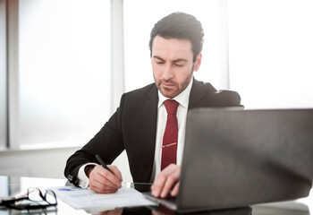 Fototapeta premium close up. businessman checking financial report.