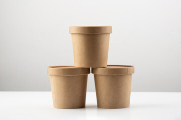 Set of brown crafted paper cup for soup on grey background. Eco package. Zero Waste. Mock up for...