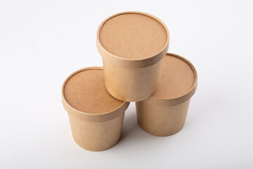 Set of brown crafted paper cup for soup on grey background. Eco package. Zero Waste. Mock up for branding.